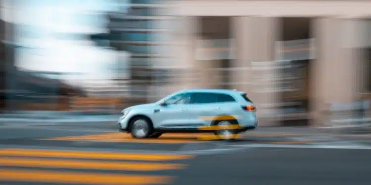 white and yellow sedan on road during daytime