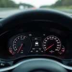 Tableau de bord de voiture affichant la vitesse en miles par heure et en kilomètres par heure